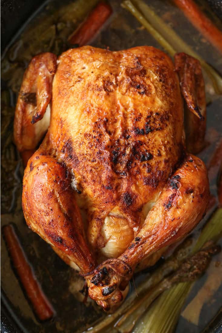 Simple Roast Chicken is perfect for Sunday dinners and for leftover meals during the week! You can even make a homemade stock with the bones! Whole Roasted Chicken in a roasting pan