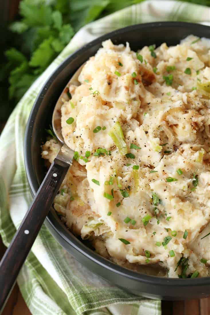 Irish mashed potatoes with a spoon sticking up out of the bowl.