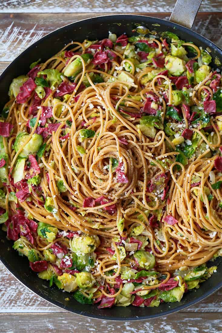 10 Leftover Corned Beef Recipes to transform your leftovers into new, fun and unique recipes. From appetizers to breakfast to dinner ideas! Corned Beef and brussels spaghetti in a skillet