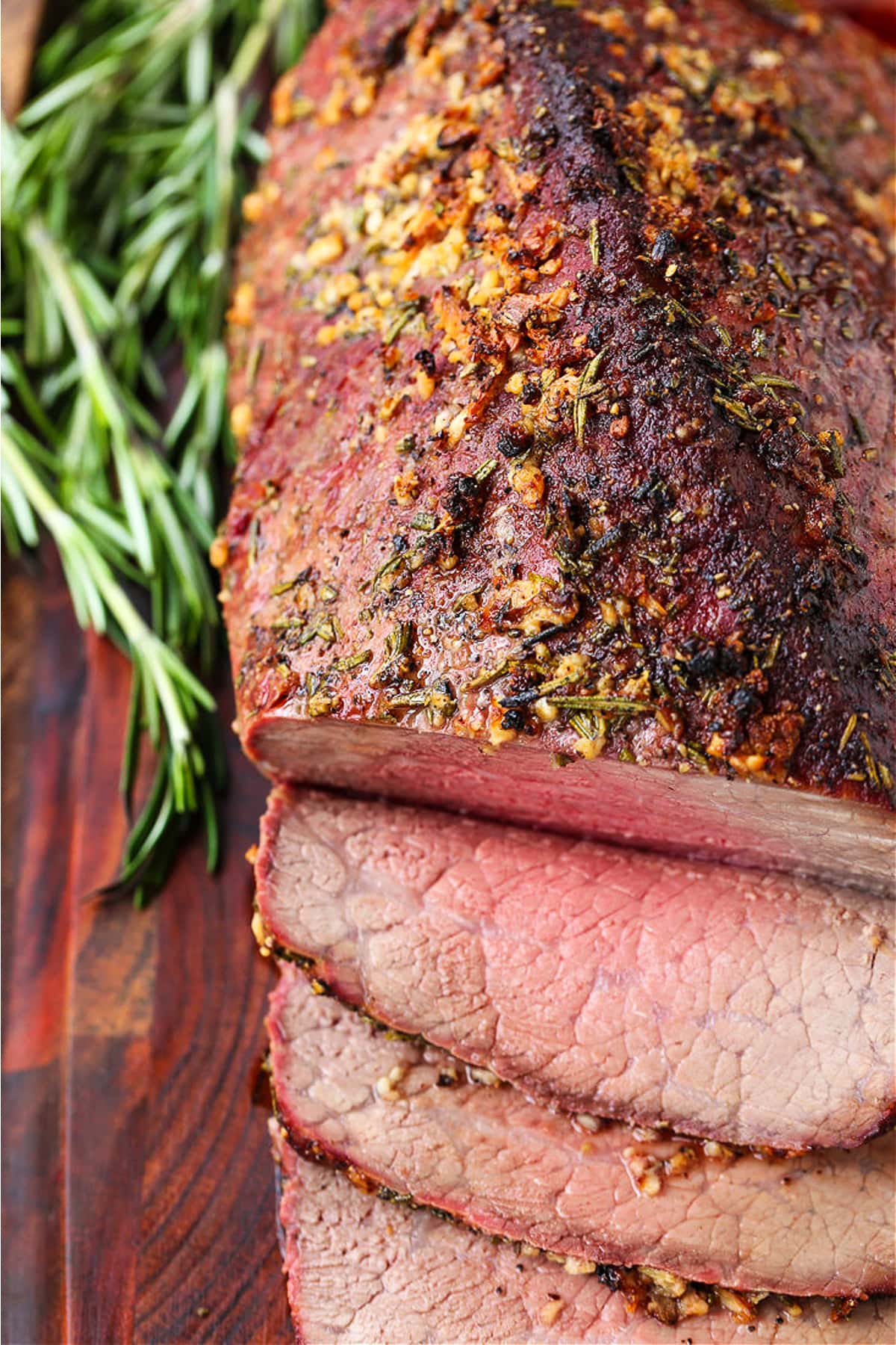 roast beef with slices on a board from top