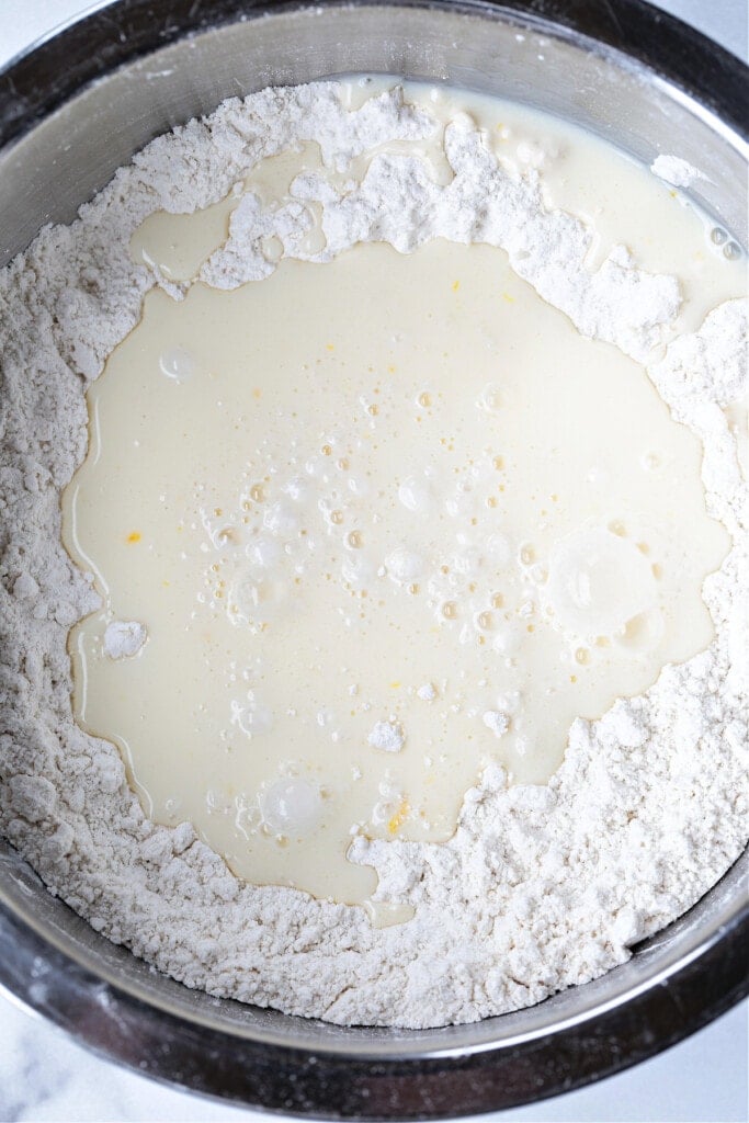 We love our slightly sweeter version of this classic Irish Soda Bread! Perfect for your St. Patrick's Day celebration, or as a homemade gift! buttermilk in flour mixture for making soda bread
