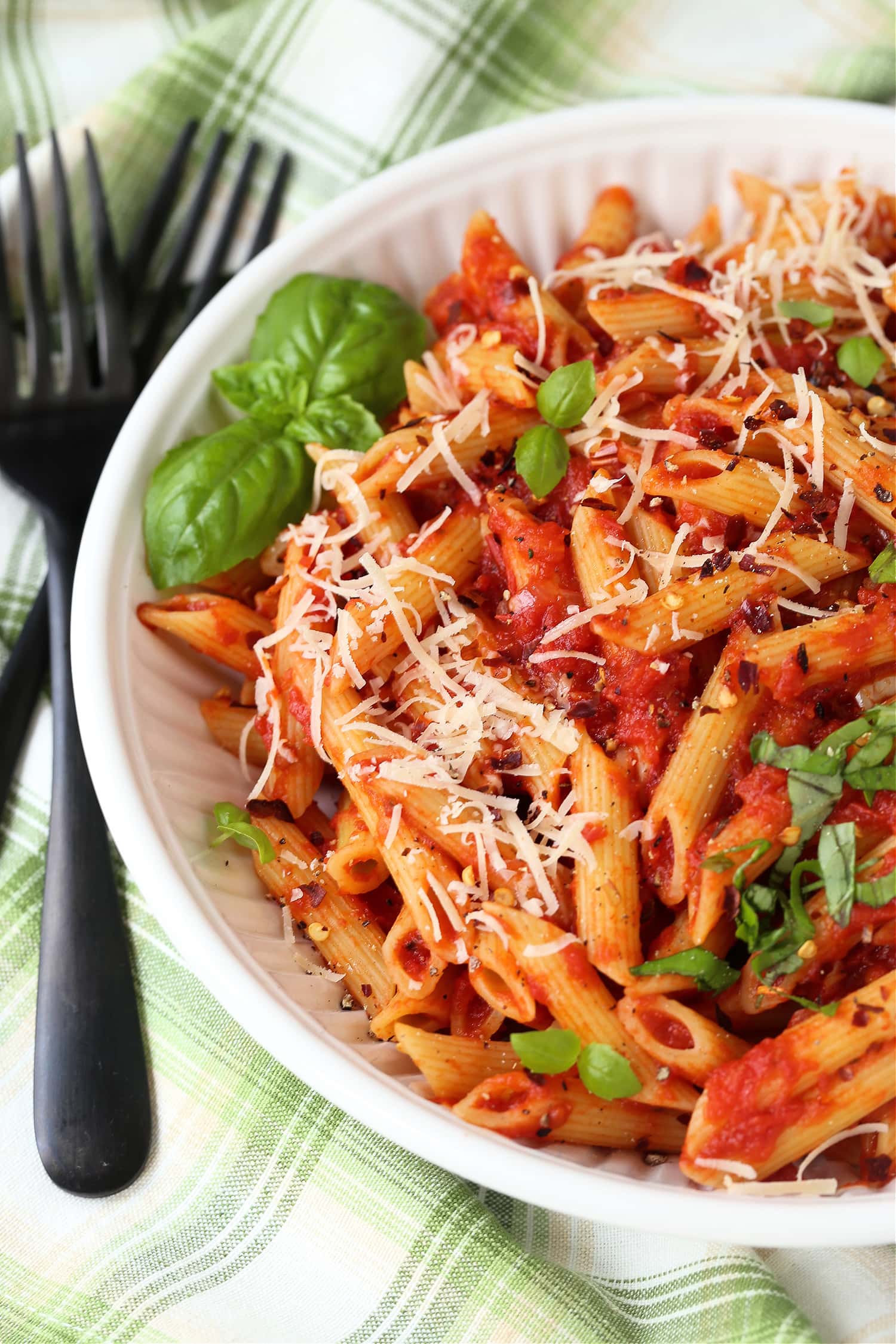 white plate with penne and homemade pasta sauce