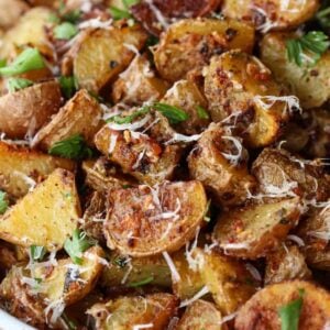 Garlic parmesan roasted potatoes in a bowl with parmesan cheese