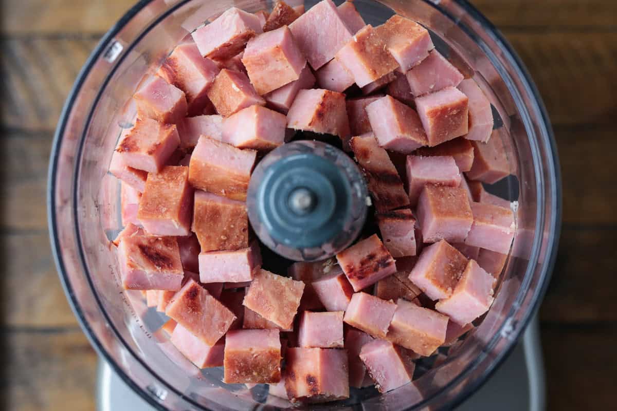 Our Ham salad recipe is the perfect way to use up leftover ham! Creamy and tangy, it’s great for sandwiches, wraps, or served with crackers. cubed ham in food processor
