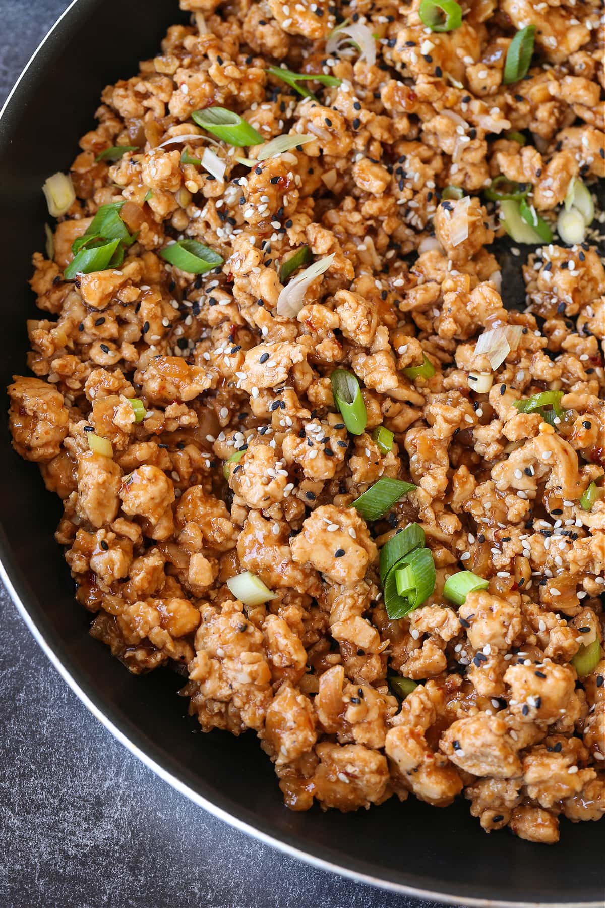 ground chicken in sesame sauce with chopped scallions