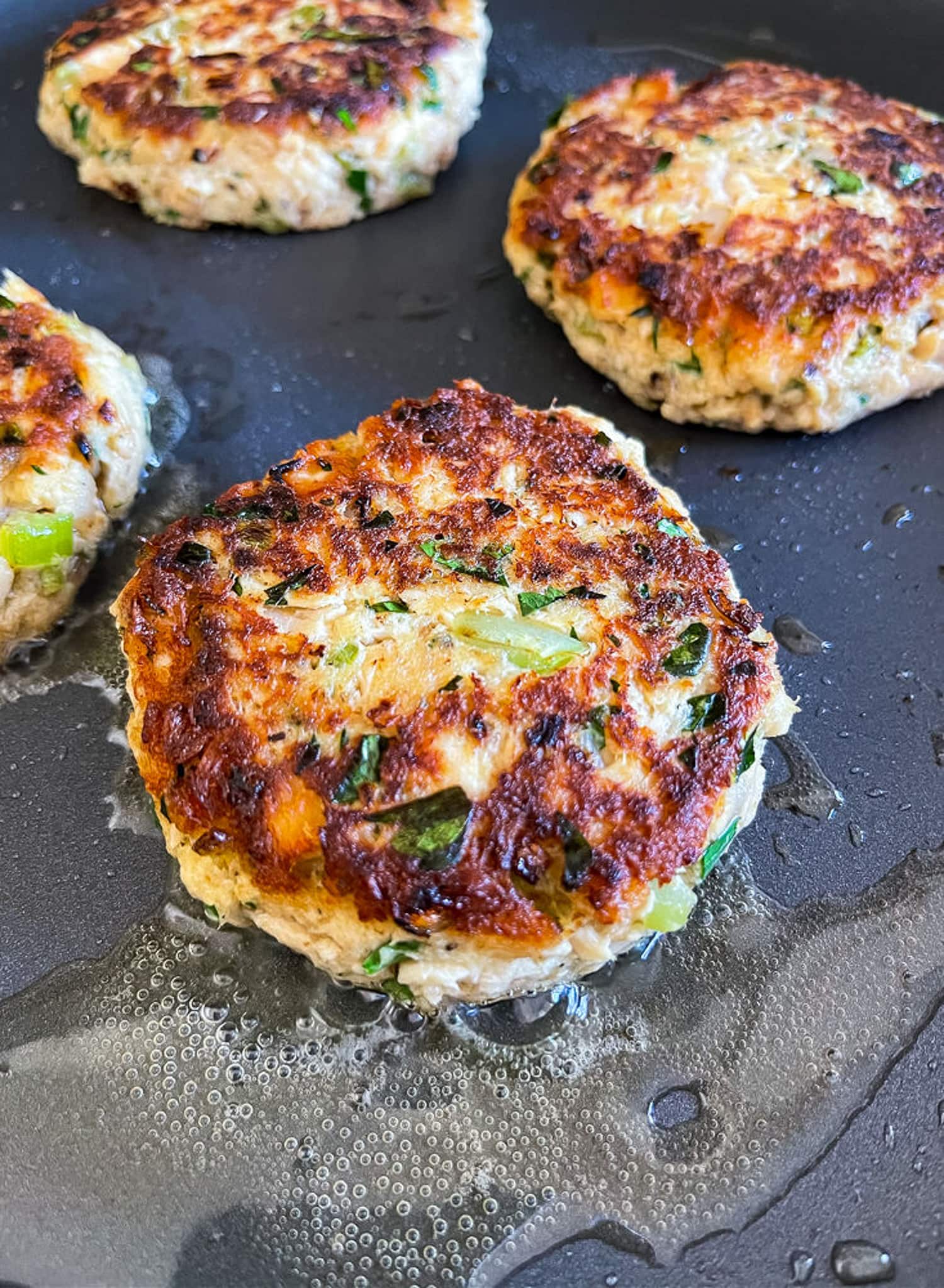 tuna cakes cooked in a skillet