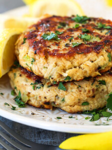 tuna cakes made with canned tuna stacked on a plate