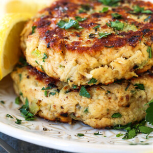 tuna cakes made with canned tuna stacked on a plate