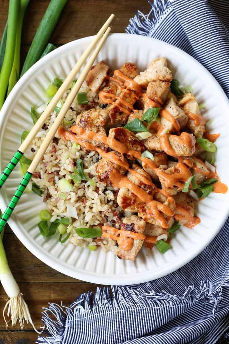 Hibachi Chicken in a bowl with rice and chop sticks