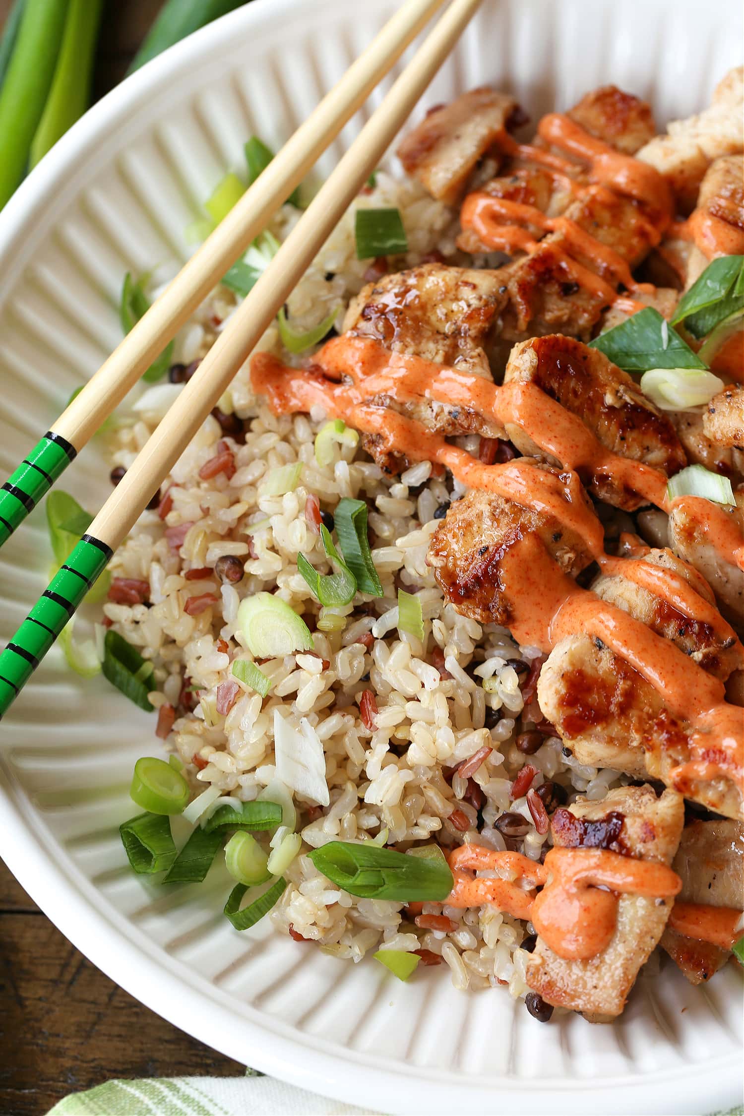 hibachi chicken with sauce on a plate with rice