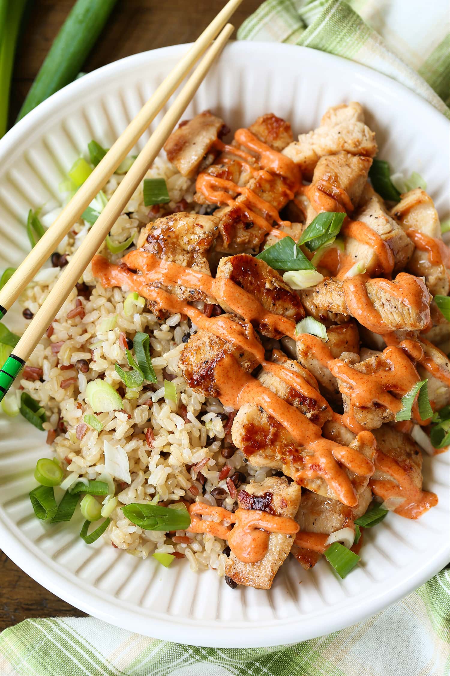 diced chicken on a plate with yum yum sauce and chop sticks