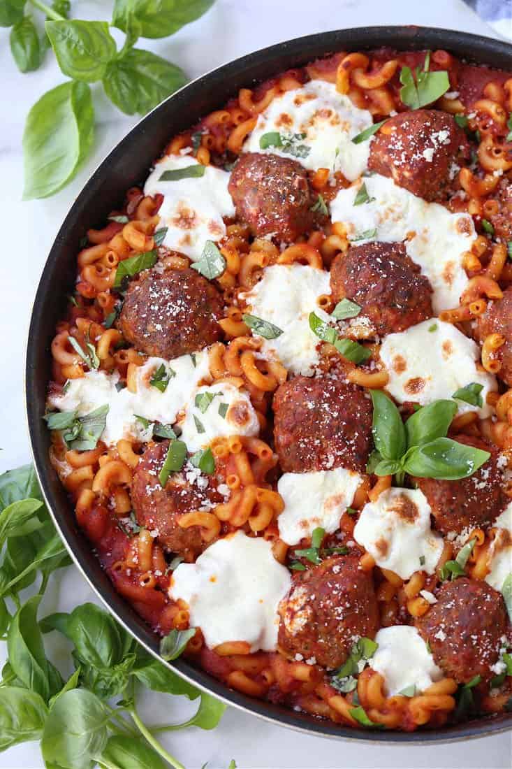 Meatballs and mozzarella cheese with baked pasta