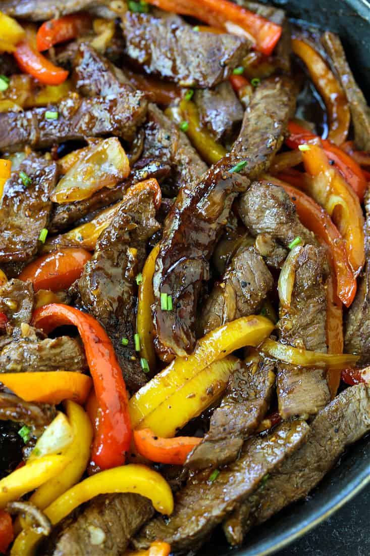 A dinner recipe made with steak and bell peppers tossed in a soy and ginger sauce
