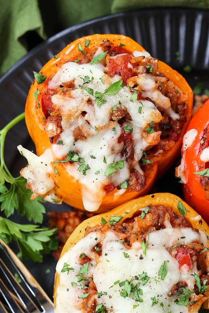 bell peppers stuffed with ground beef and rice and topped with mozzarella cheese