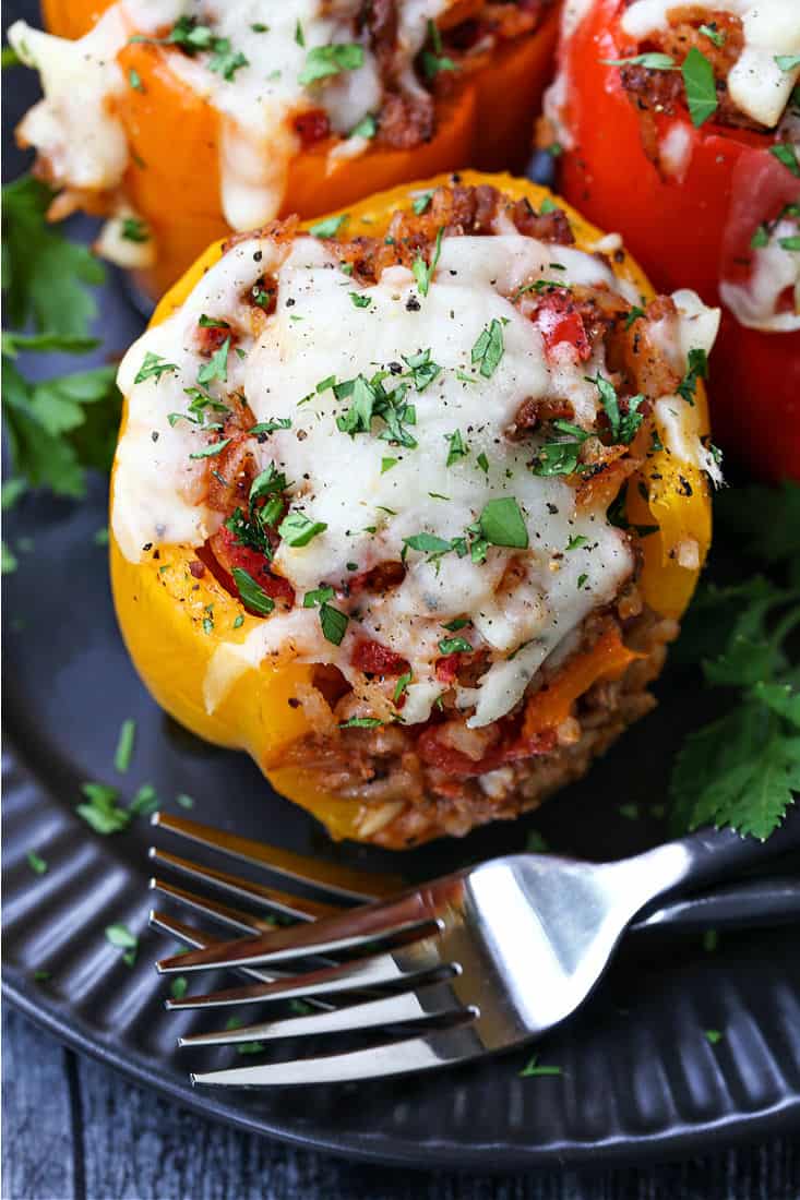 baked pepper with a ground beef, rice and tomato sauce filling