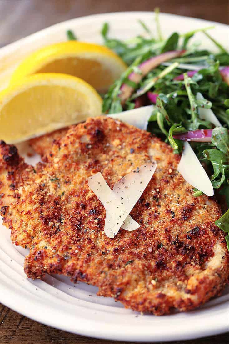 Turkey or Chicken cutlets with lemon wedges and salad