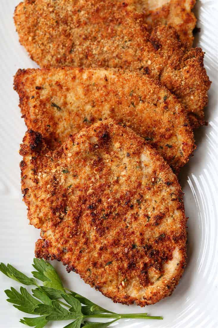 Turkey or chicken cutlets stacked on a platter