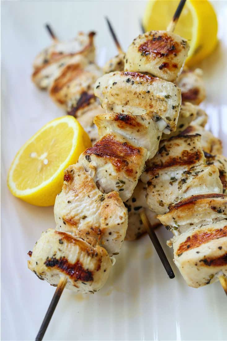 Grilled chicken kabobs on a platter to make chicken souvlaki