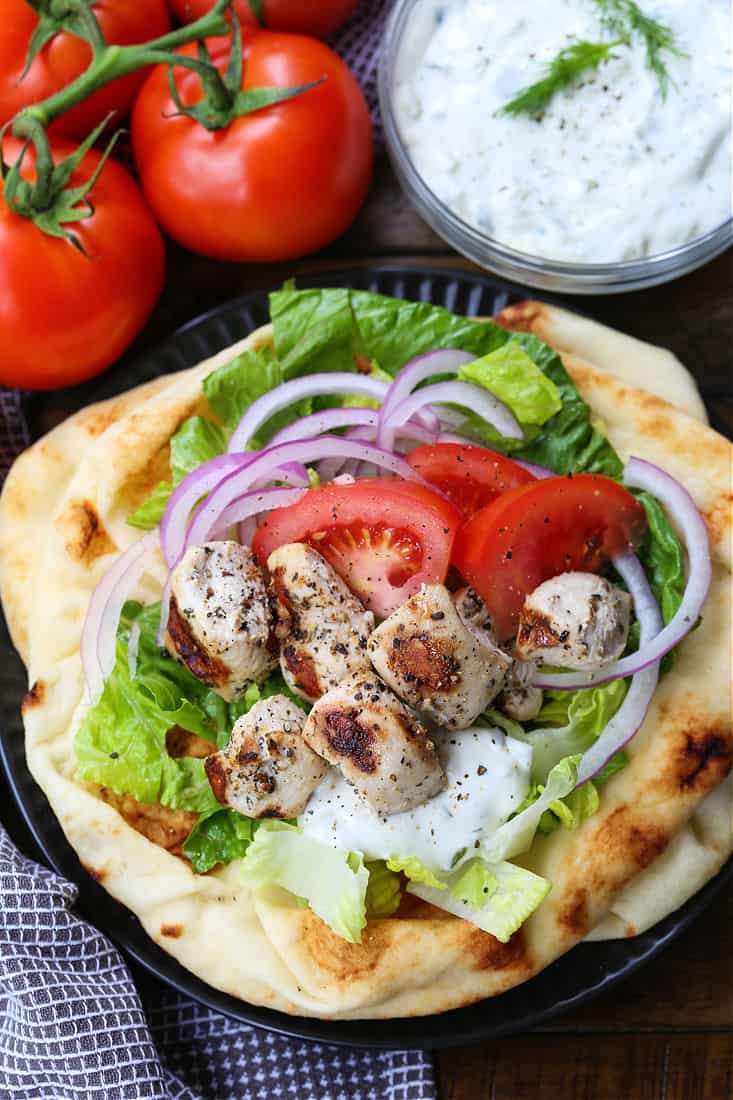 Chicken Souvlaki on a pita with garnish