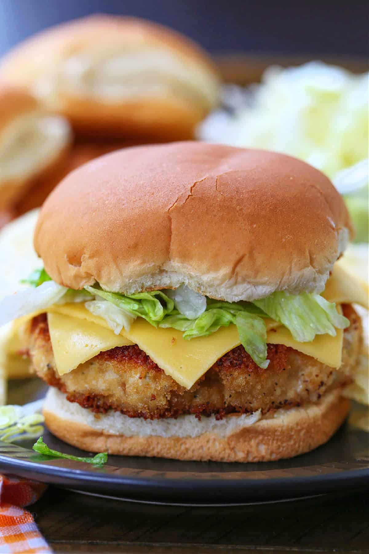 chicken patty sandwich on bun with lettuce and cheese