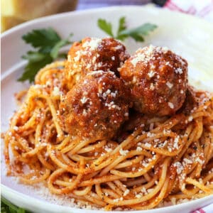 meatballs and sauce recipe served on top of spaghetti