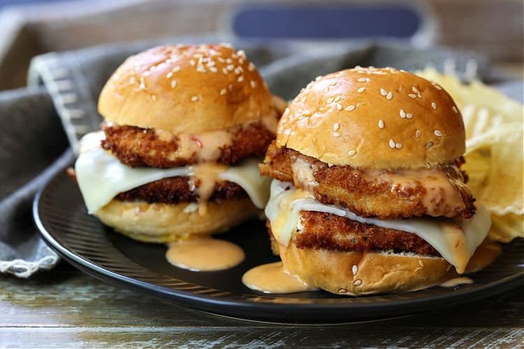 Bang Bang Chicken Sliders on a black plate