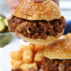 Cafeteria Sloppy Joes being held in hand