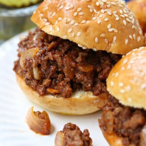 Sloppy Joe sliders on a plate with tater tots