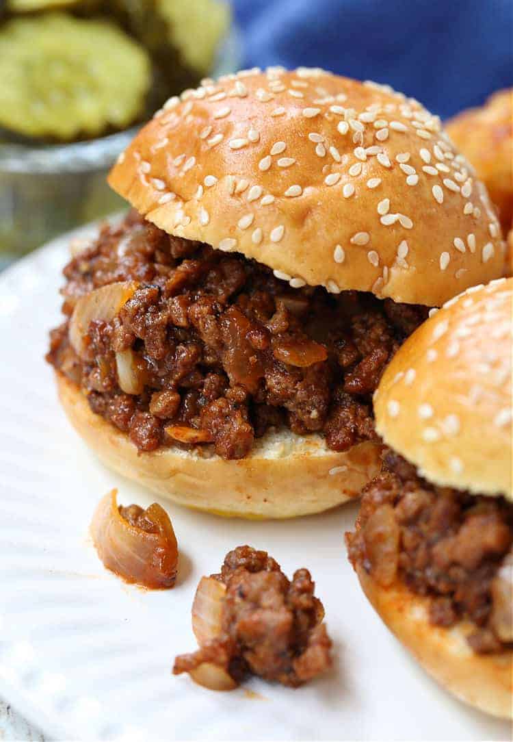 Sloppy Joe sliders on a plate with tater tots
