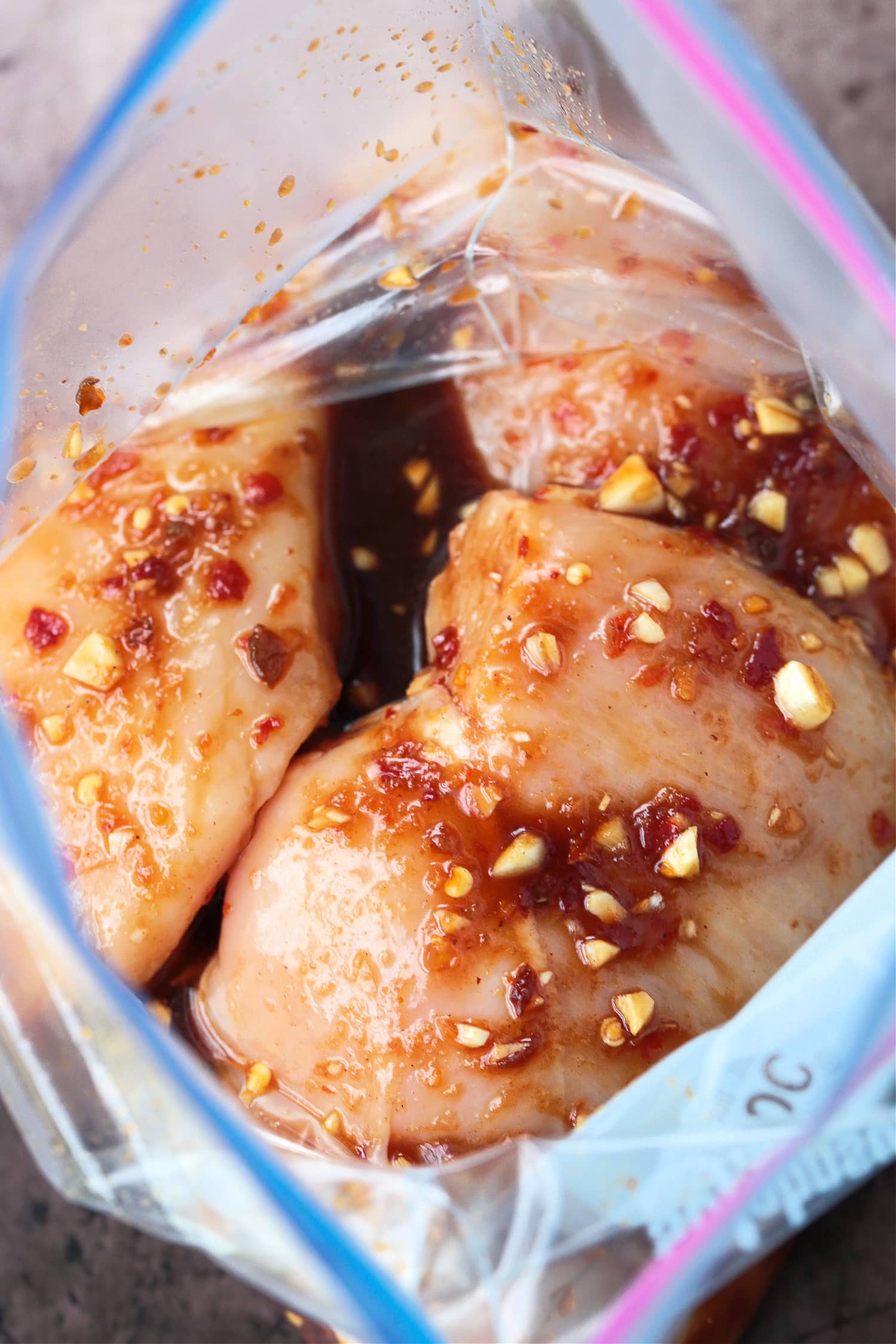 chicken marinating in plastice bag