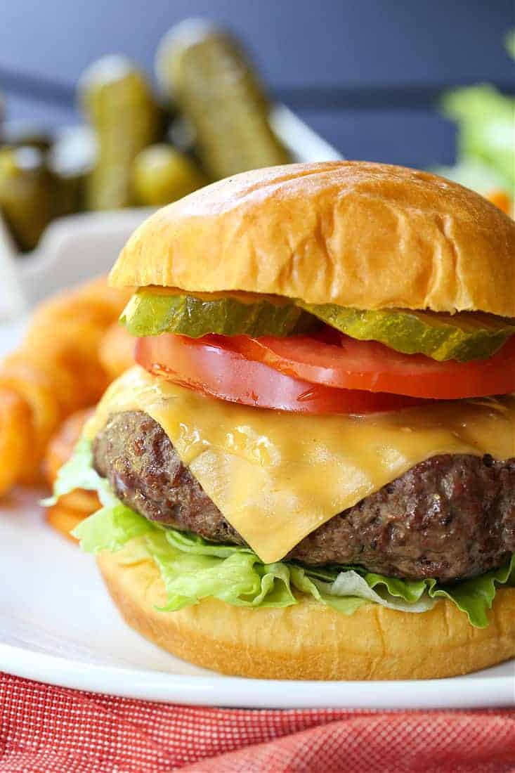 Homemade Hamburgers with toppings and french fries