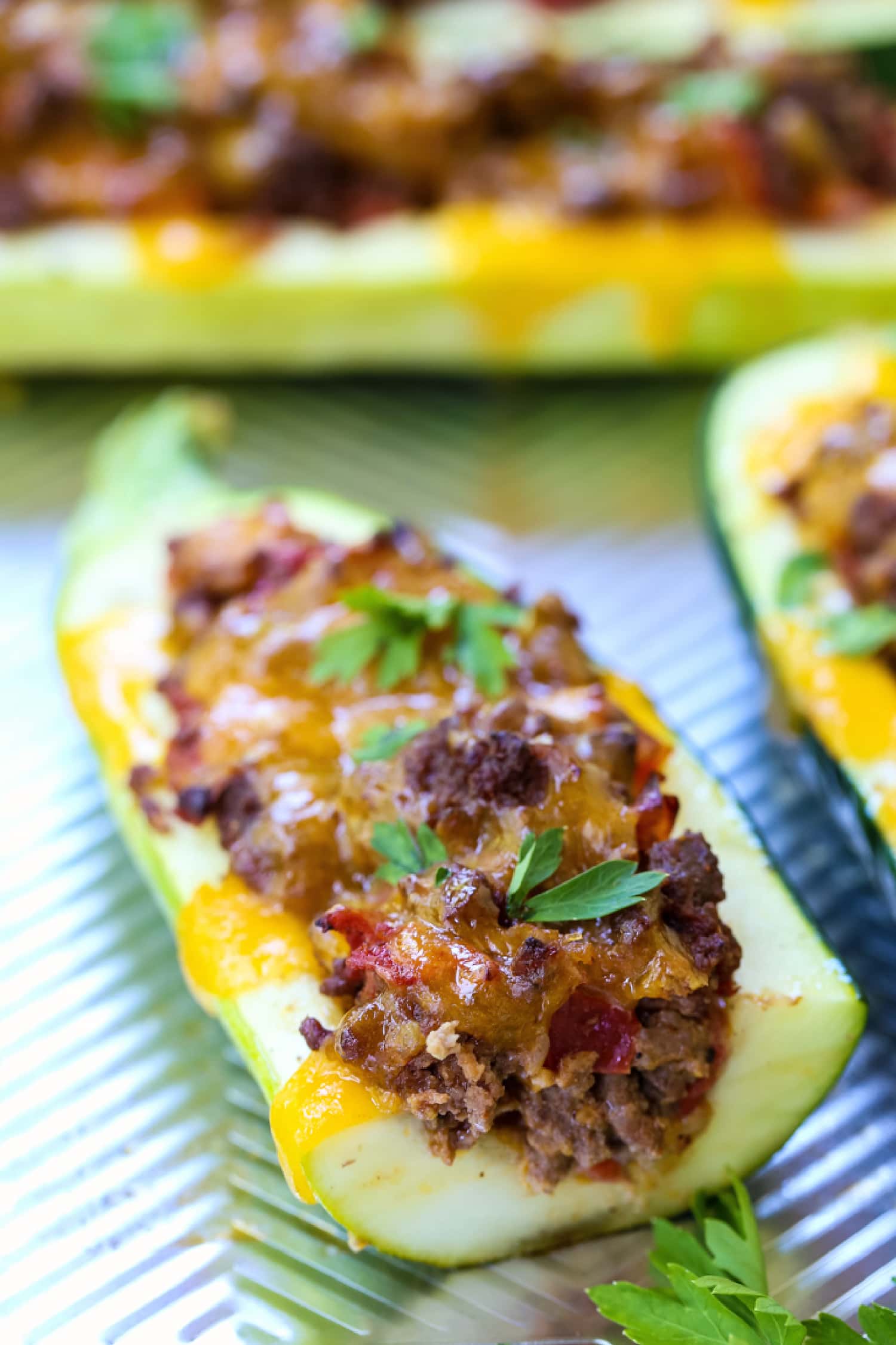 taco zucchini boats cut in half on baking sheet