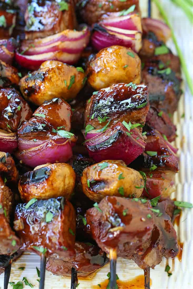 Bourbon Steak Kabobs with vegetables and chopped parsley