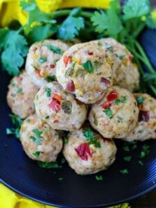 Chicken Meatballs with peppers on a plate with cilantro