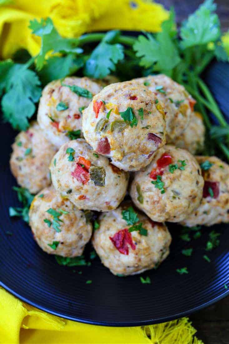 Chicken Meatballs with peppers on a plate with cilantro
