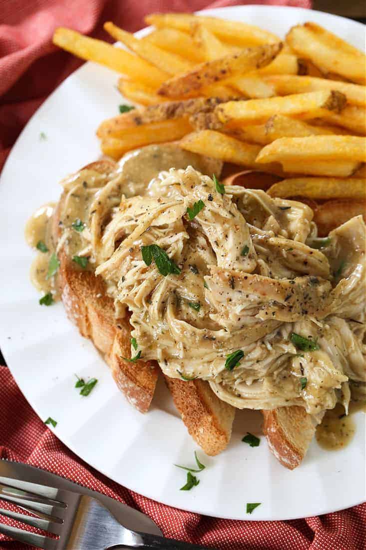 Crock Pot Chicken and Gravy served over toast with french fries