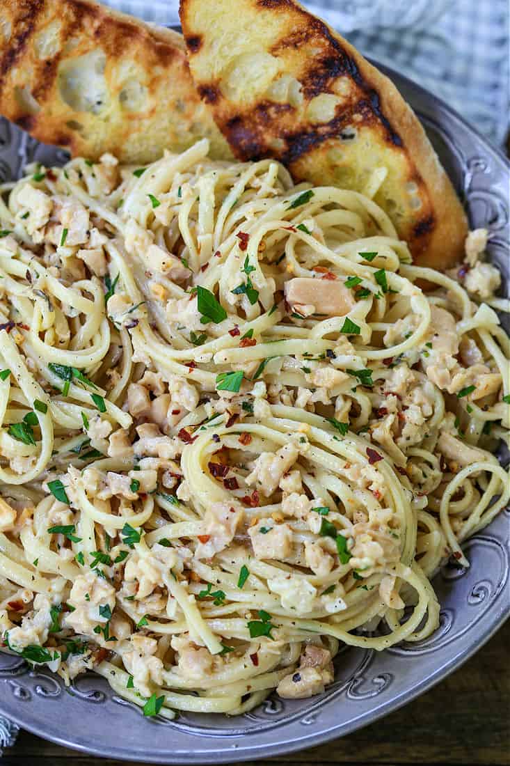 Linguine with Clam Sauce in a bowl with toasted bread pieces