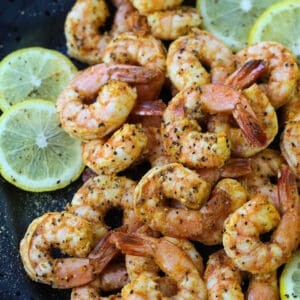 Lemon Pepper Shrimp made in an air fryer on a black plate