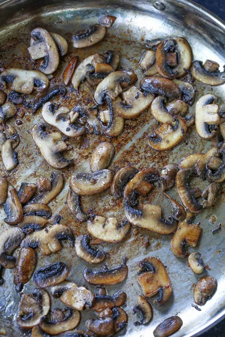 Browned mushrooms in a skillet for spaghetti recipe