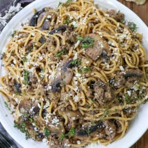 Spaghetti with ground beef and mushrooms on a plate