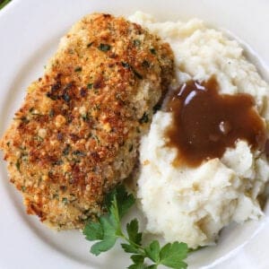 baked pork chops with mashed potatoes on the side