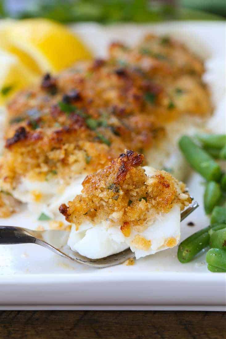 Parmesan Crusted Haddock recipe with a bite on a fork