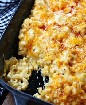 macaroni and cheese with a scoop out in baking dish