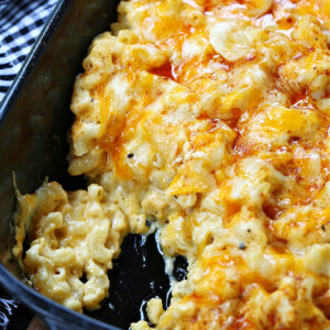 macaroni and cheese with a scoop out in baking dish