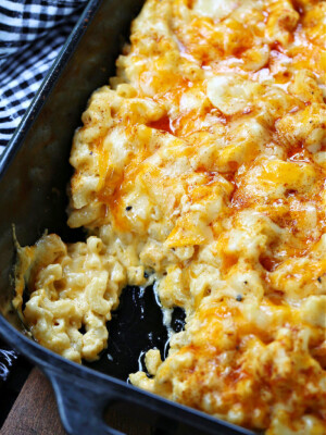 macaroni and cheese with a scoop out in baking dish