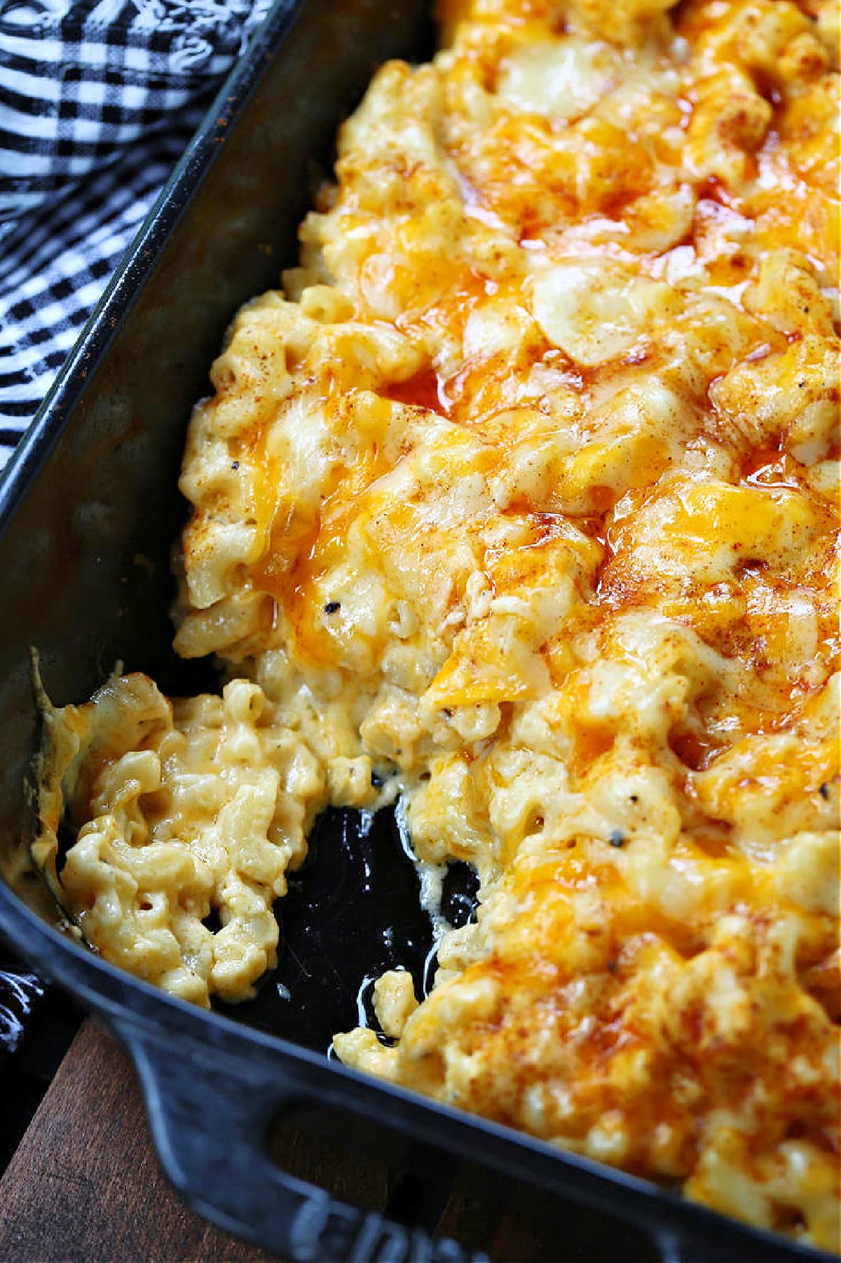 macaroni and cheese with a scoop out in baking dish