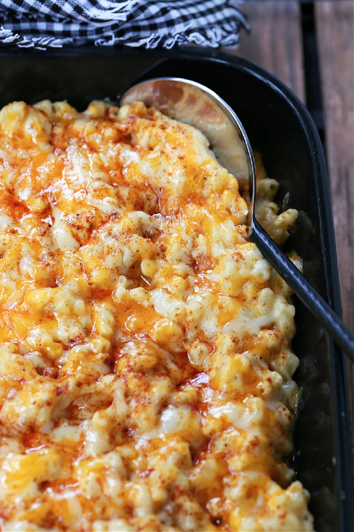 macaroni and cheese casserole with serving spoon