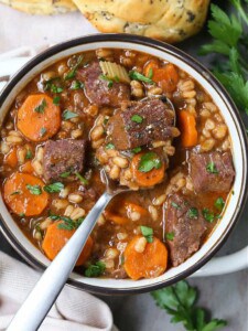 Beef Barely soup in a bowl with a spoon