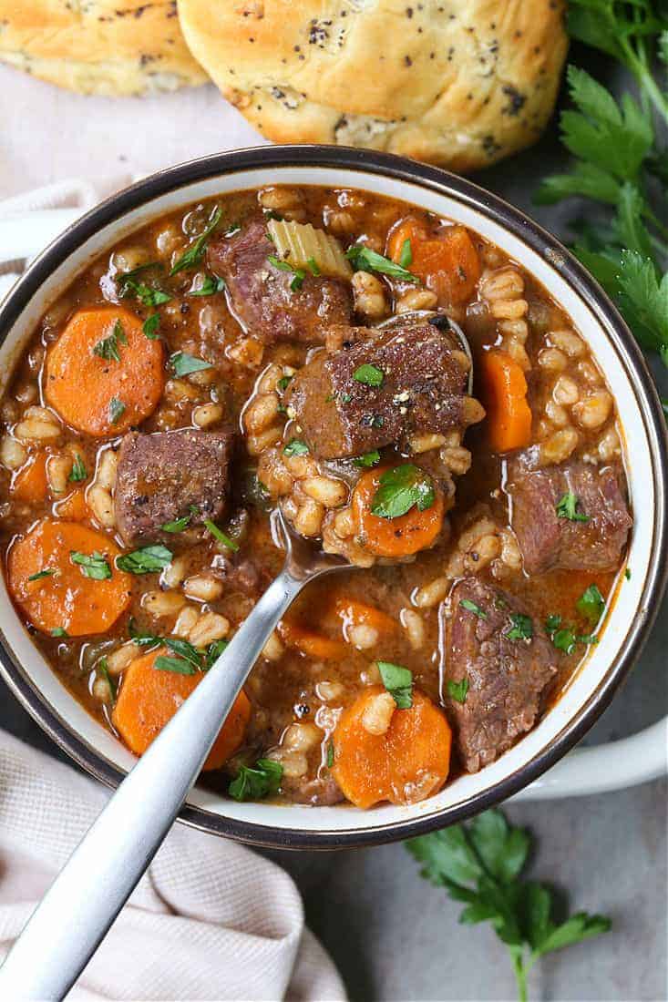 Beef Barely soup in a bowl with a spoon