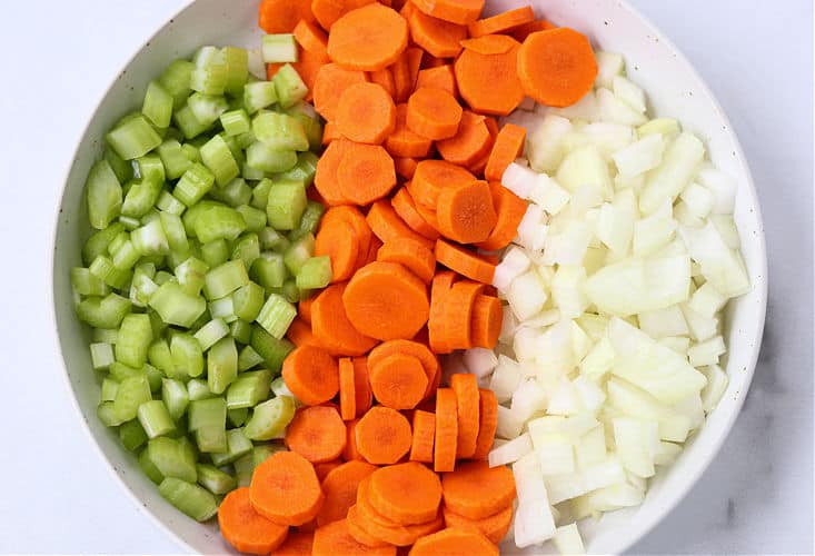 Carrots, onions and celery to start the base of a beef soup recipe